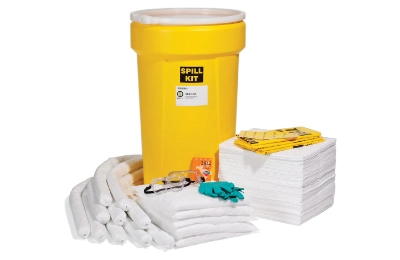 Assorted yellow spill kits with absorbents, gloves, and disposal bags