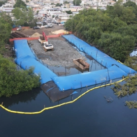 Blue inflated water cofferdam stopping flood
