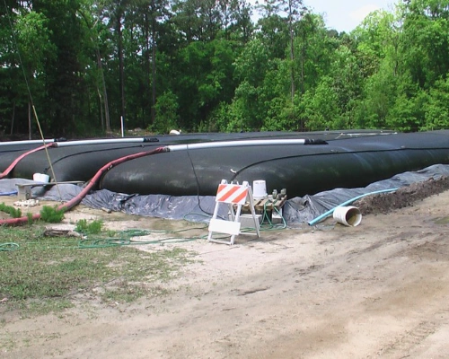 Manifold with polymer dosing feeding multiple dewatering tubes at a sewage plant in the District of Columbia