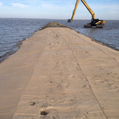 getube placed on the water with a machine working in the background