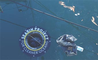 Seabin in water with plastic bag