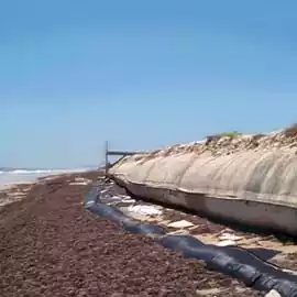 dewatering tubes on a beach