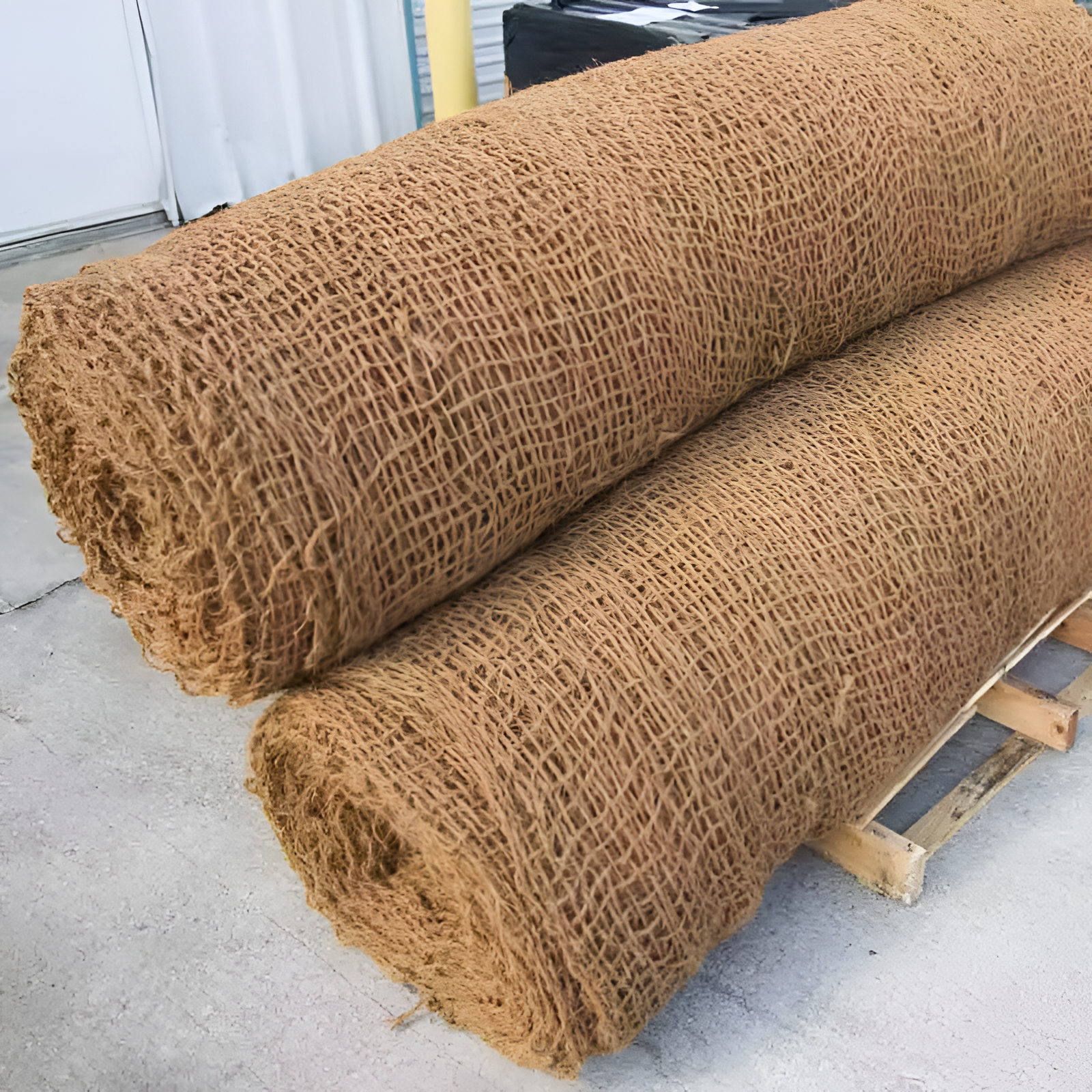 Rolled coir mat ready for installation in erosion control projects.