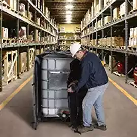 Man wrapping a DEF tote with a heater