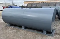 grey farm fuel skid tanks on the ground