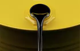 Oil pouring out of yellow 55 gallon drum