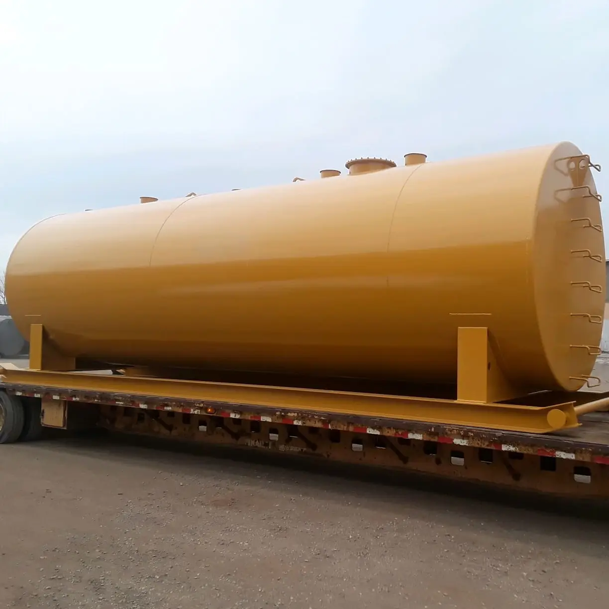 yellow saddle above ground fuel tanks