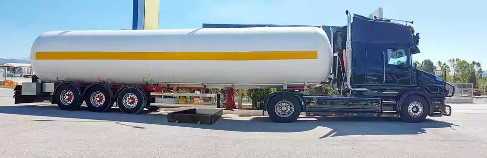 Spill berm deployed under a semi truck